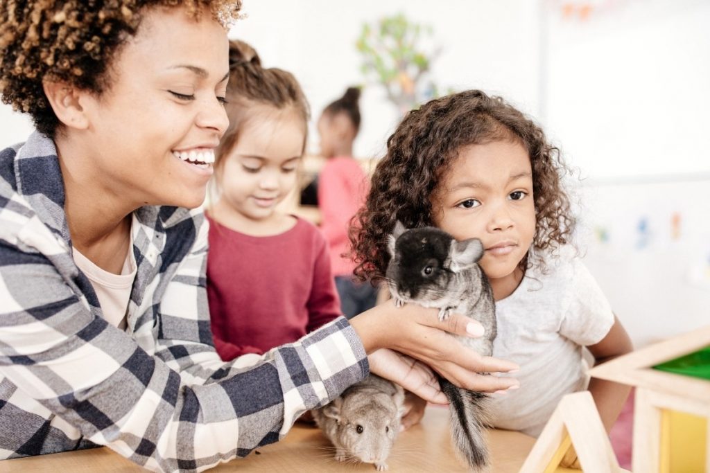 Mother and Child playing with an emotional support animal