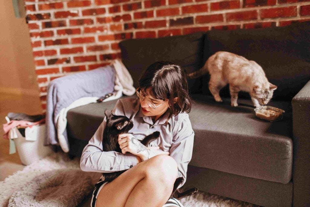Woman with Cats in Apartment
