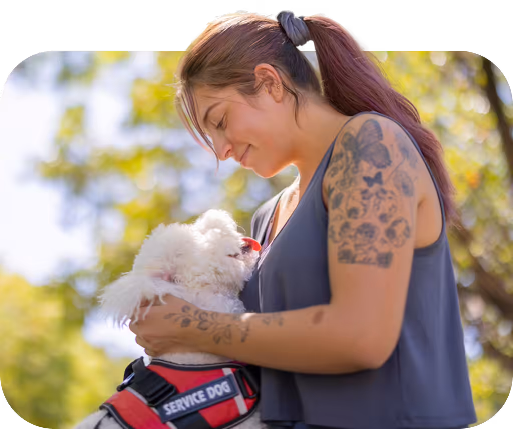 woman and her service dog at a park